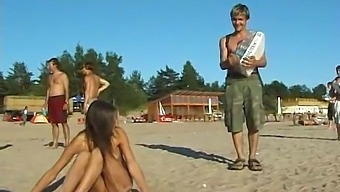 A Stunning Young Girl Enjoys Nude Play At The Beach